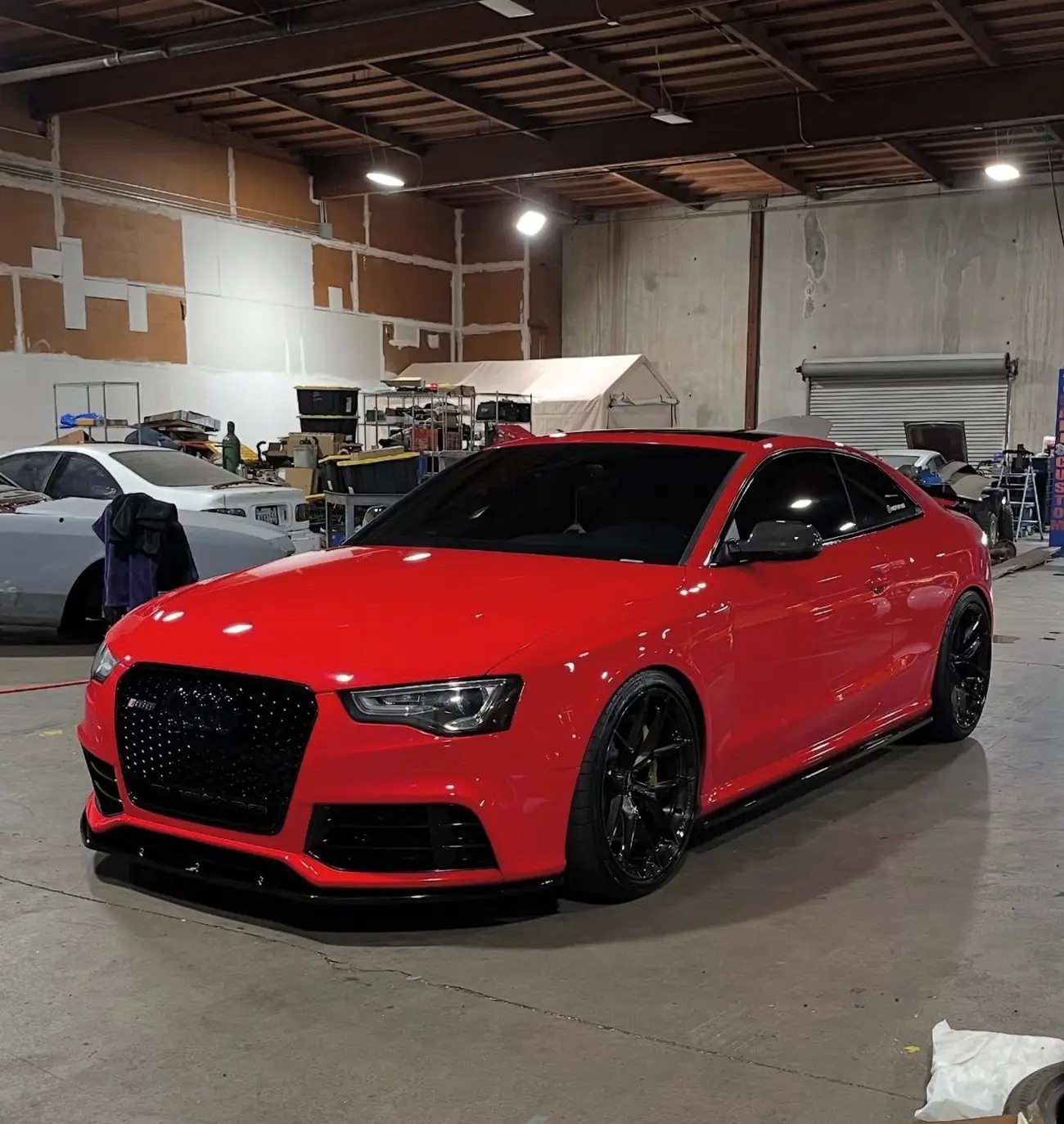 Red Audi photographed in the shop after a detailing session