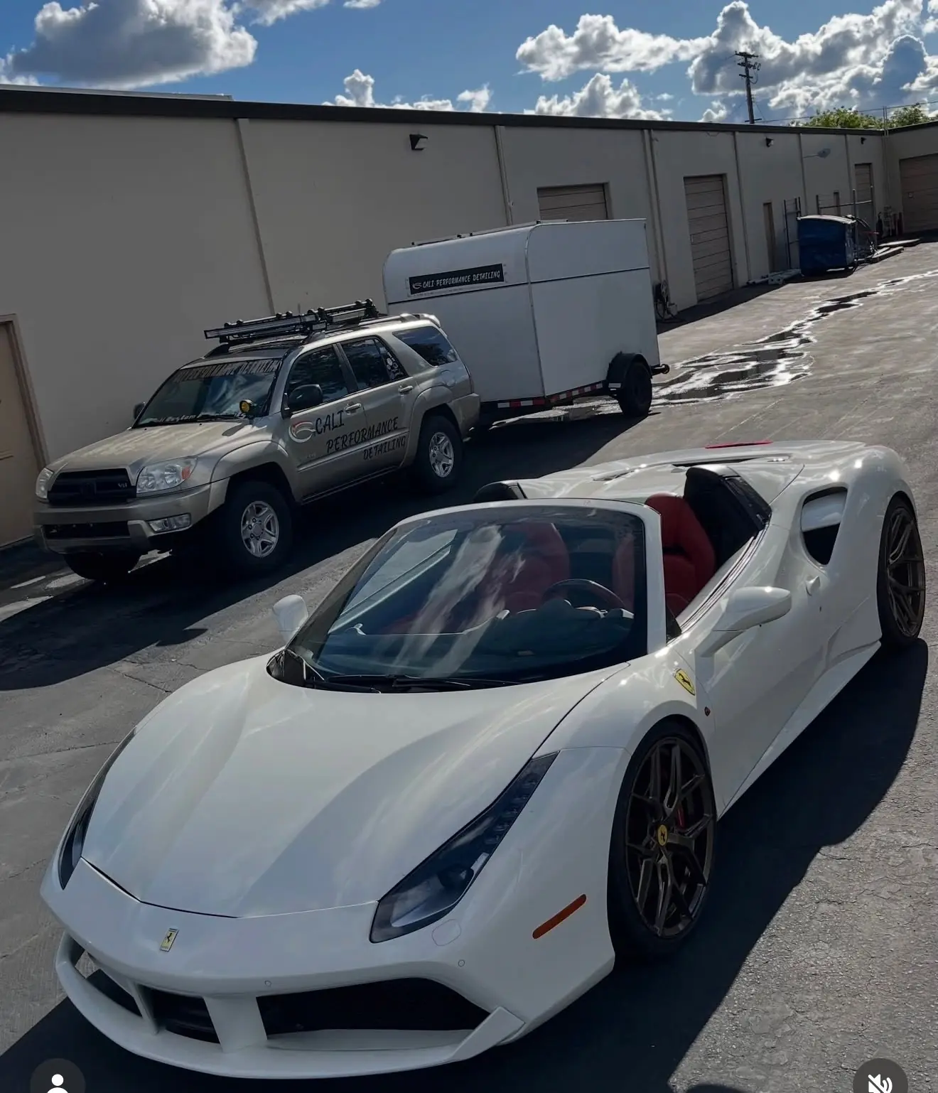 White Ferrari 488 Spider beside the Cali Performance Detailing truck