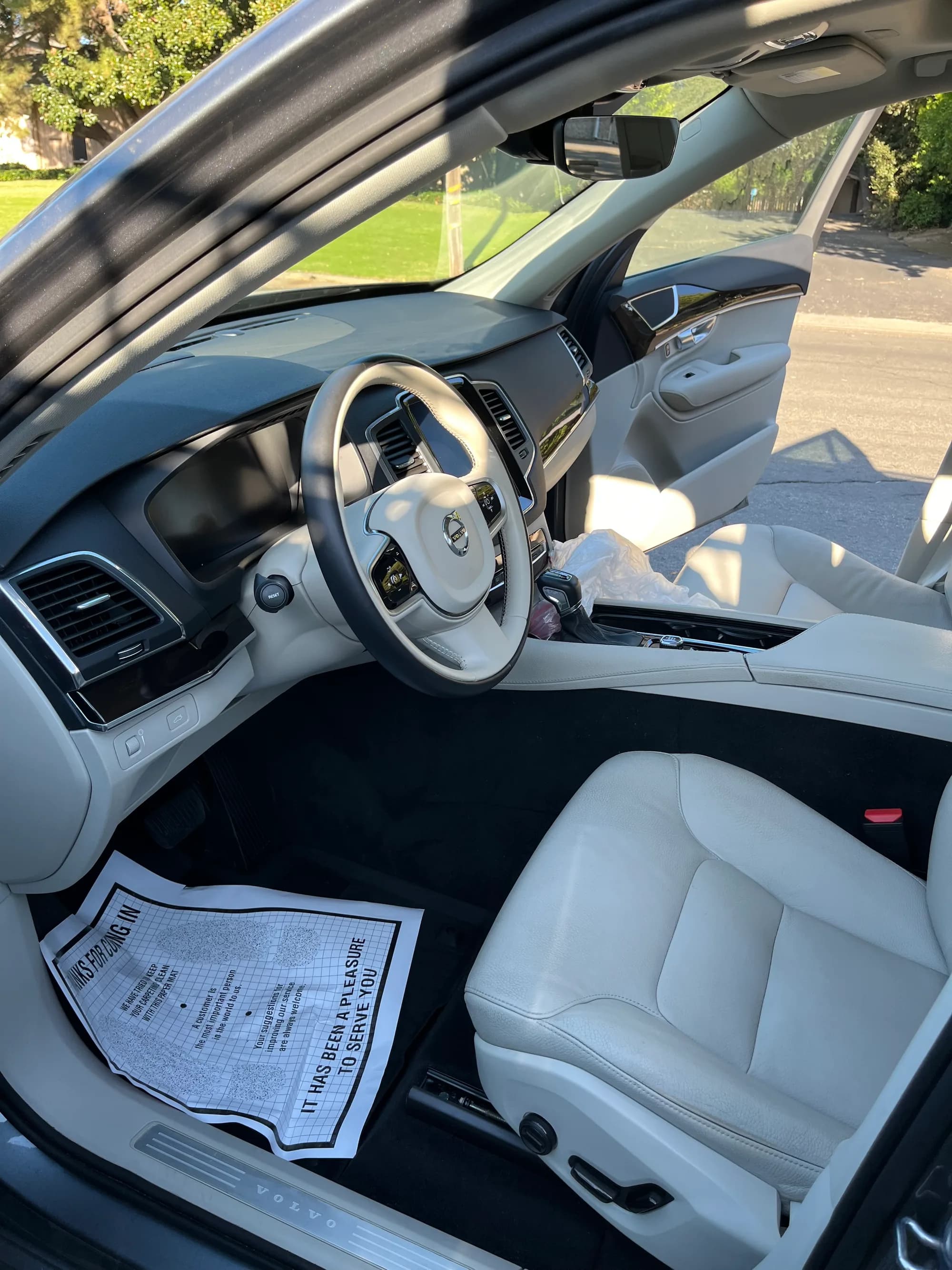 Front cabin of a beige Volvo after interior detailing