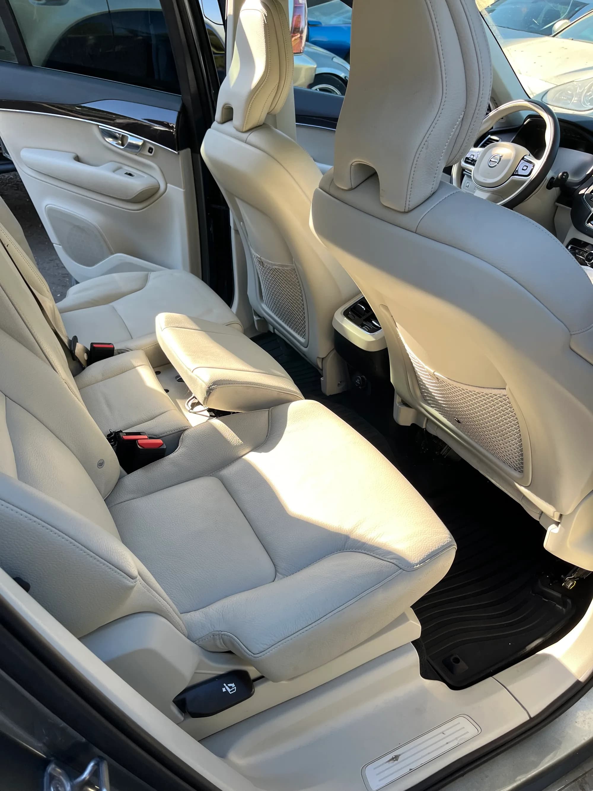 Beige leather rear seats of a Volvo after interior detailing